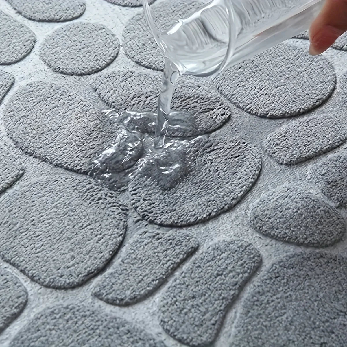 Thickened embossed water and oil absorbent carpet flannel